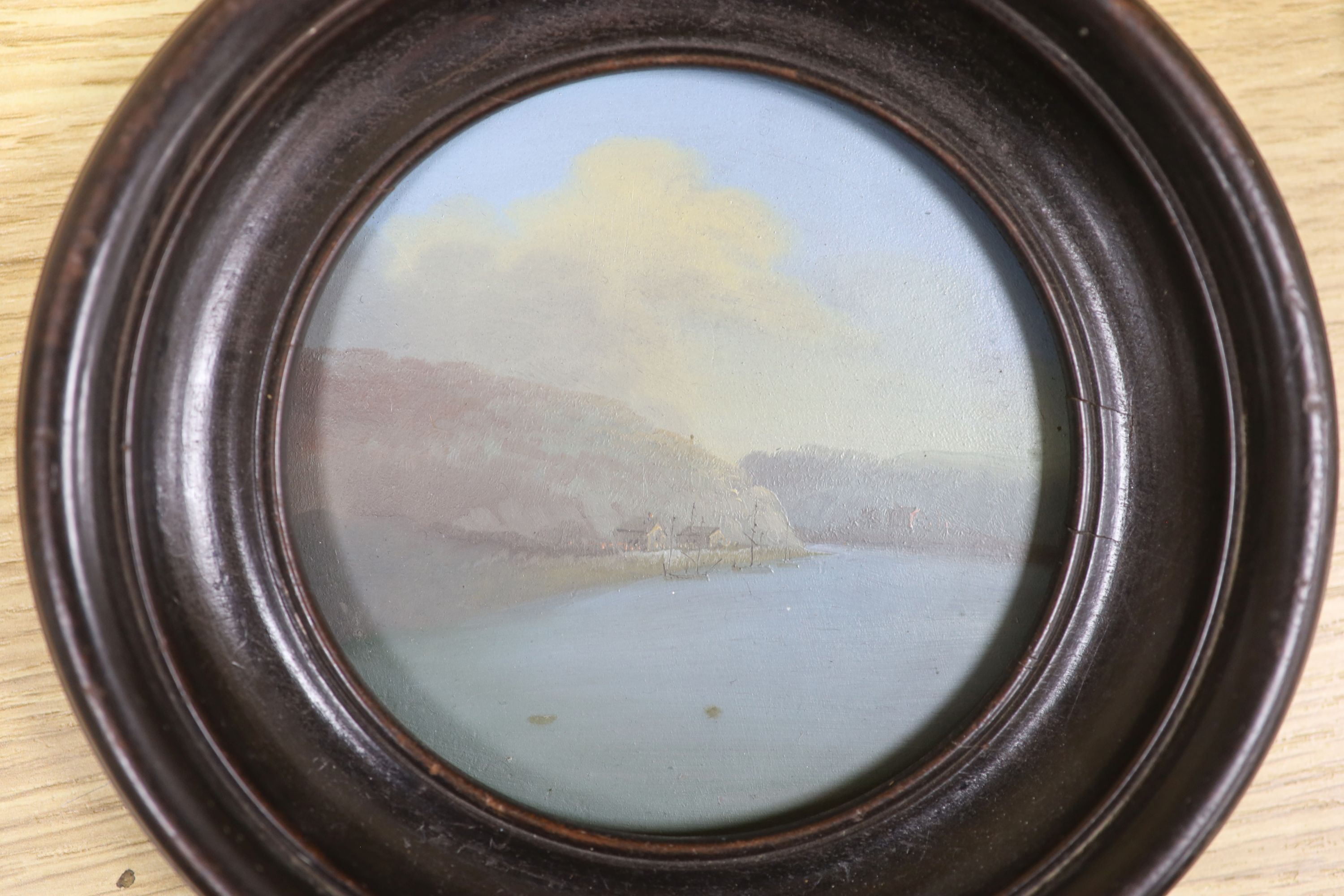Continental School c.1900, oil on zinc, Coastal landscape, tondo, 11cm and an oval colour print after Reynolds